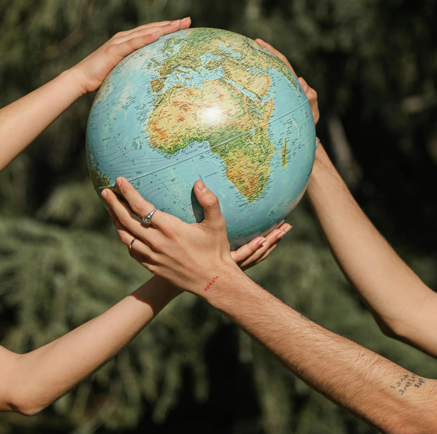 C S Textile sustainability &mdash; hands holding the globe